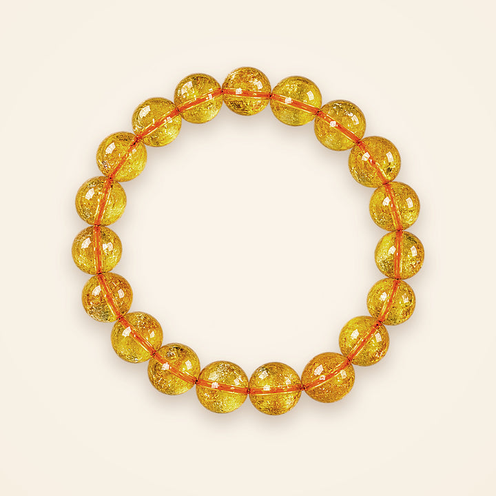 Citrine Bracelet, top view on an ivory background